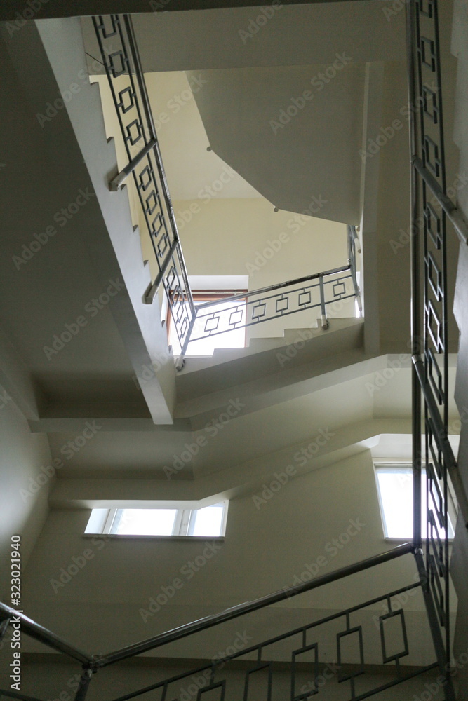 Fototapeta premium Staircase inside the building to the third floor