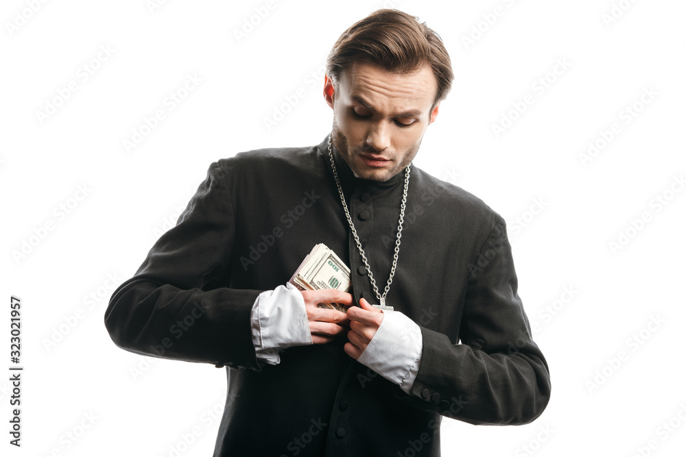 greedy catholic priest hiding money in cassock isolated on white greedy catholic priest hiding money in cassock isolated on white