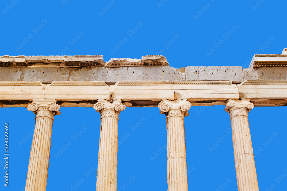 Greek columns isolated. Ancient Greece stone pillars background. Pantheon construction site in Athens, Greece. Empty copy space Acropolis landmark.