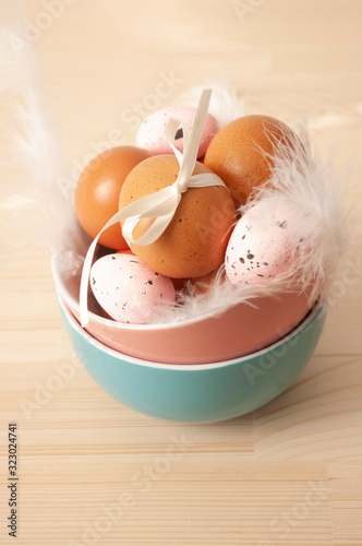 chicken eggs, quail eggs in ceramic bowl, easter food, traditional, catholic, orthodox holiday. Easter 2020. photo