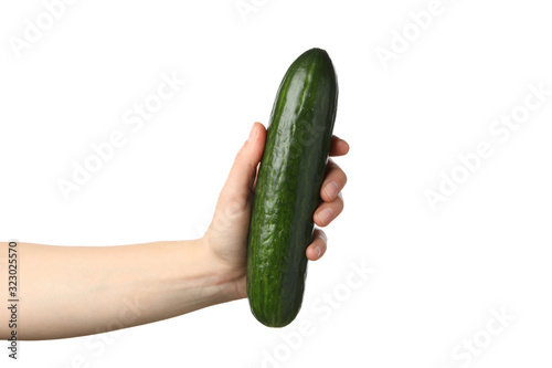 Female hand holding cucumber, isolated on white background