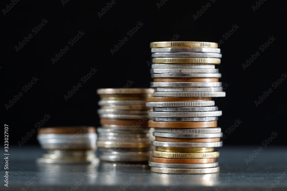 Three piles of coins represents an improvement Three piles of coins represents an improvement