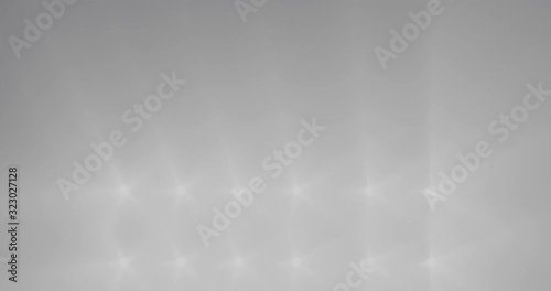 Bright lights turn on and off in order in a looped animation.