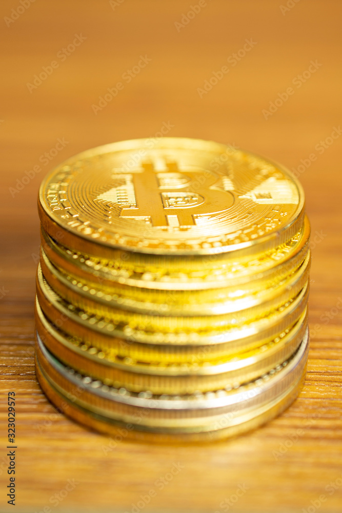 Row of cryptocurrency coins on wooden table, vertical orientation image with selective focus for finance and business concept. Row of cryptocurrency coins on wooden table, vertical orientation image with selective focus for finance and business concept.