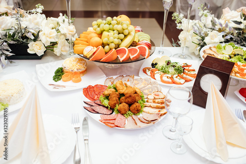 Beautifully served banquet table with cold, hot appetizers. View from the top.
