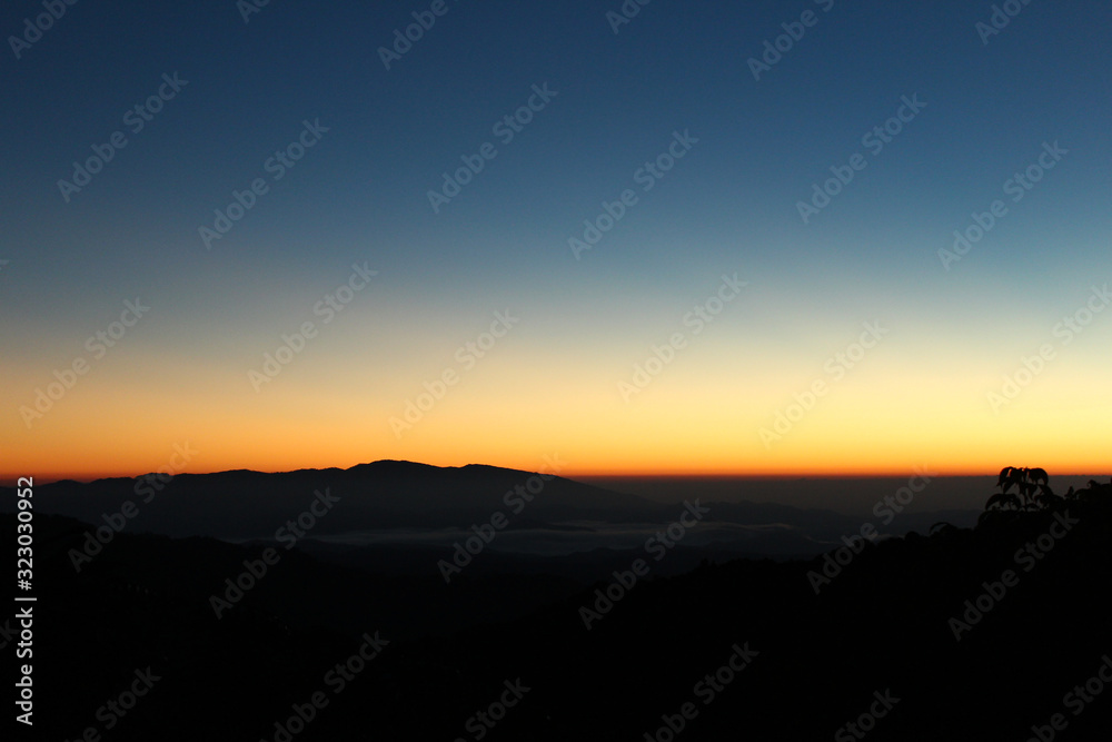 Mountain and dramatic sky sunrise background.