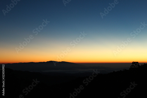 Mountain and dramatic sky sunrise background.