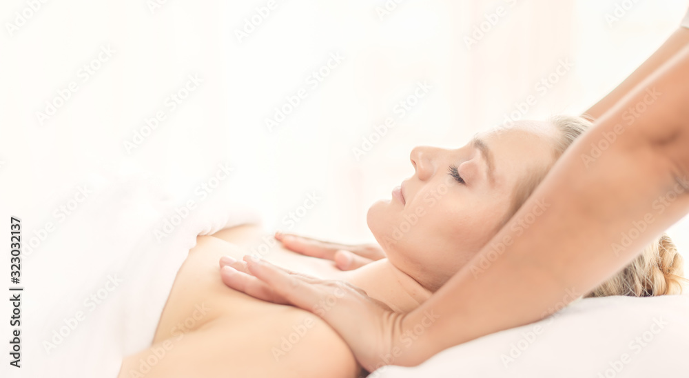 Beautiful young woman relaxing with Thai massage at beauty spa. Body salt massage. Closed up of young beautiful woman getting spa massage treatment at beauty spa salon. Beautiful young woman relaxing with Thai massage at beauty spa. Body salt massage. Closed up of young beautiful woman getting spa massage treatment at beauty spa salon.