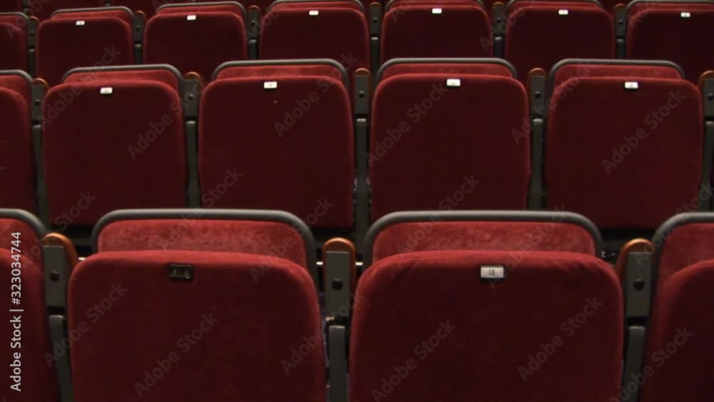 Empty Auditorium seats with no people - The rows of chairs in the hall have nobody in them. Stock Video Clip Footage. Tilt shot Empty Auditorium seats with no people - The rows of chairs in the hall have nobody in them. Stock Video Clip Footage. Tilt shot