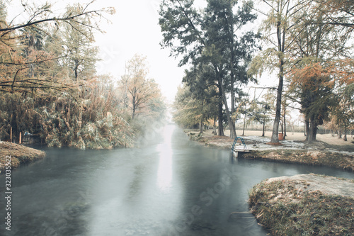 Hot Spring, Blurred photo of morning fog over a lake in cold autumn weather in half moon san luis potosi
