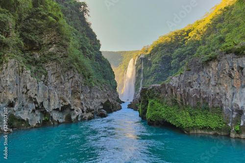 River and amazing crystalline blue water of Tamul waterfall in San Luis Potosí, Mexico photo