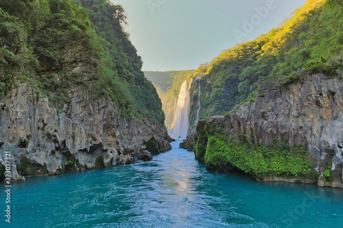 River and amazing crystalline blue water of Tamul waterfall in San Luis Potosí, Mexico