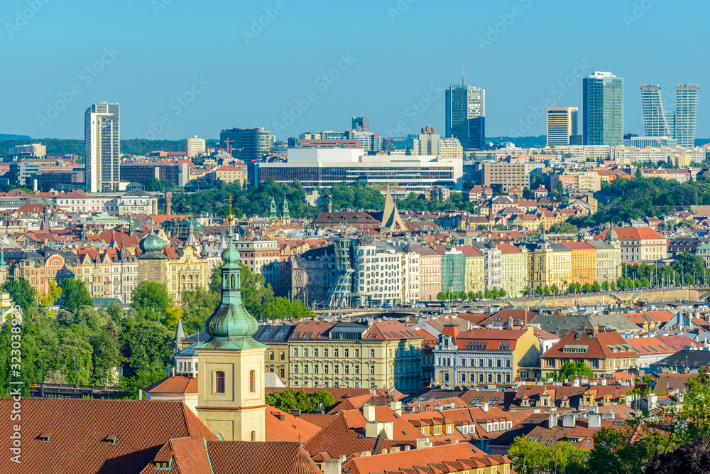 Top view to red roofs and green trees skyline of Prague city Czech republic.