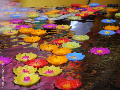 Lotus candles floating on water