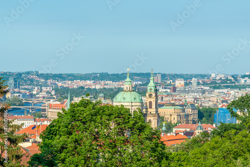 Top view to red roofs and green trees skyline of Prague city Czech republic.