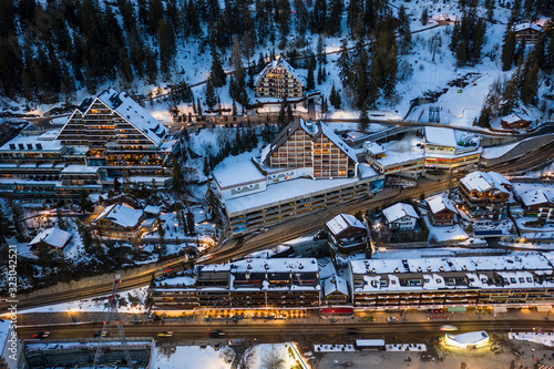 Aerial view of Crans-Montana village center with many like chalet style hotel and residence in Valais, Switzerland