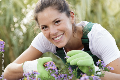 happy woman is proud of her own garden