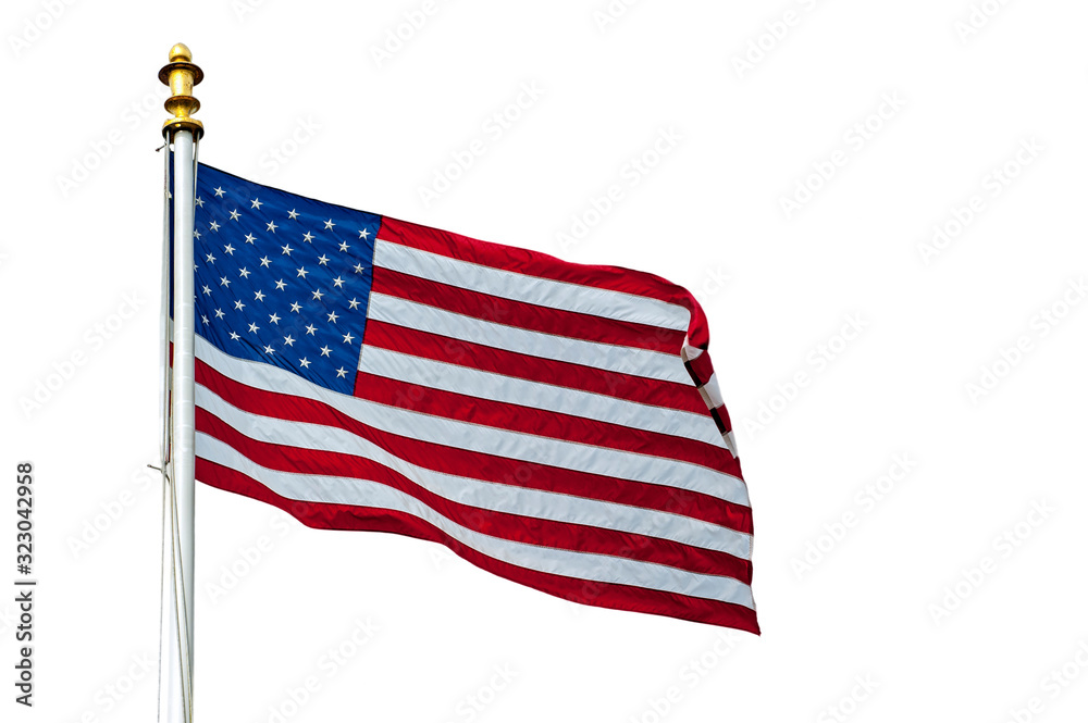 Fototapeta premium American flag showing US Stars and Stripes blowing in the wind against white background