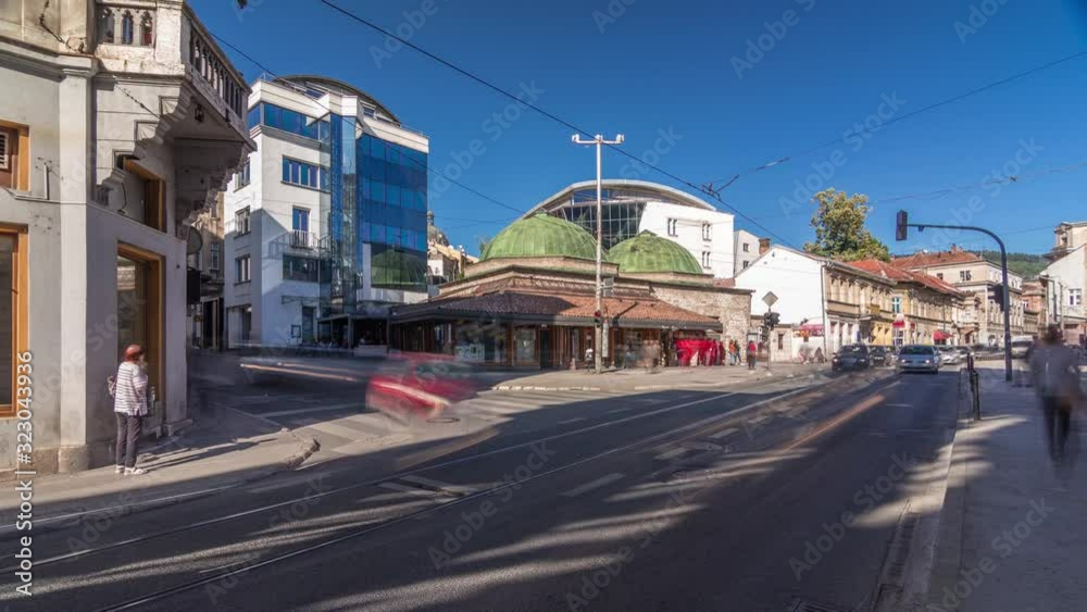 Bosniak Institute timelapse hyperlapse, in a renovated Turkish bathhouse, includes a library and art collection focusing on Bosniak culture. Street with cars and public transport at Sarajevo city Bosniak Institute timelapse hyperlapse, in a renovated Turkish bathhouse, includes a library and art collection focusing on Bosniak culture. Street with cars and public transport at Sarajevo city