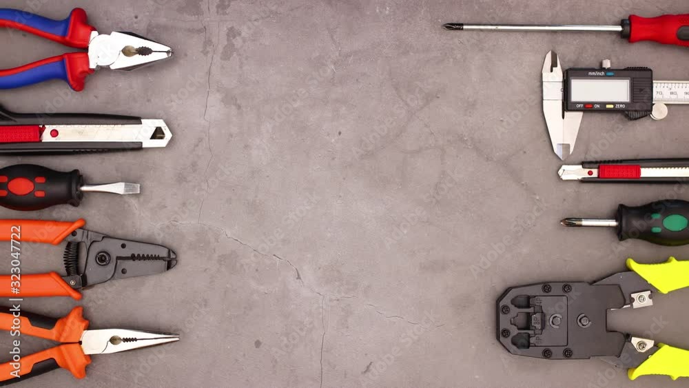 Construction tools moving on left and right side of the working table - Stop motion do it yourself 