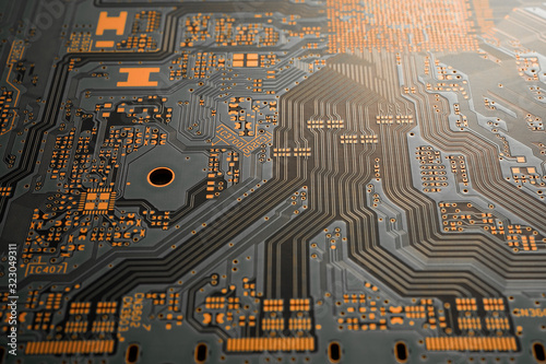 A close-up of black blank Printed circuit board (PCB) with no component mounted (copper exposed) photo