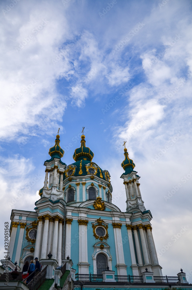 Travel to Ukraine - building of St Andrew`s Church in Kyiv city under cloudy sky