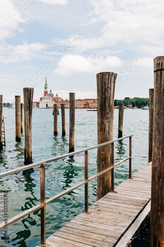 View of the canal from the pier in city of Venice, Italy