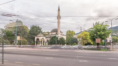 Ali Pasha Mosque timelapse hyperlapse with traffic on intersection, It was completed in 1561 after plans of Hadim Ali Pasha, Sarajevo, Bosnia and Herzegovina. photo