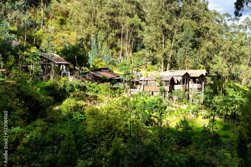 Farmhouse cottage in the rural mountainous part of Ecuador among rolling hills and coffee plantations which may also serve as tourist jungle lodge.
