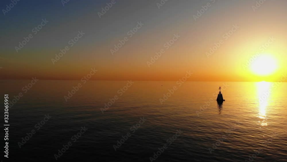 Peaceful see evening time when the sun is going down and we see a sunset. Peaceful see evening time when the sun is going down and we see a sunset.