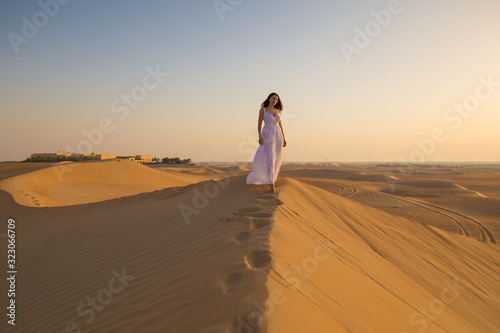 UAE. Woman in desert