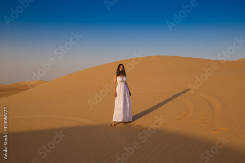 UAE. Woman in desert