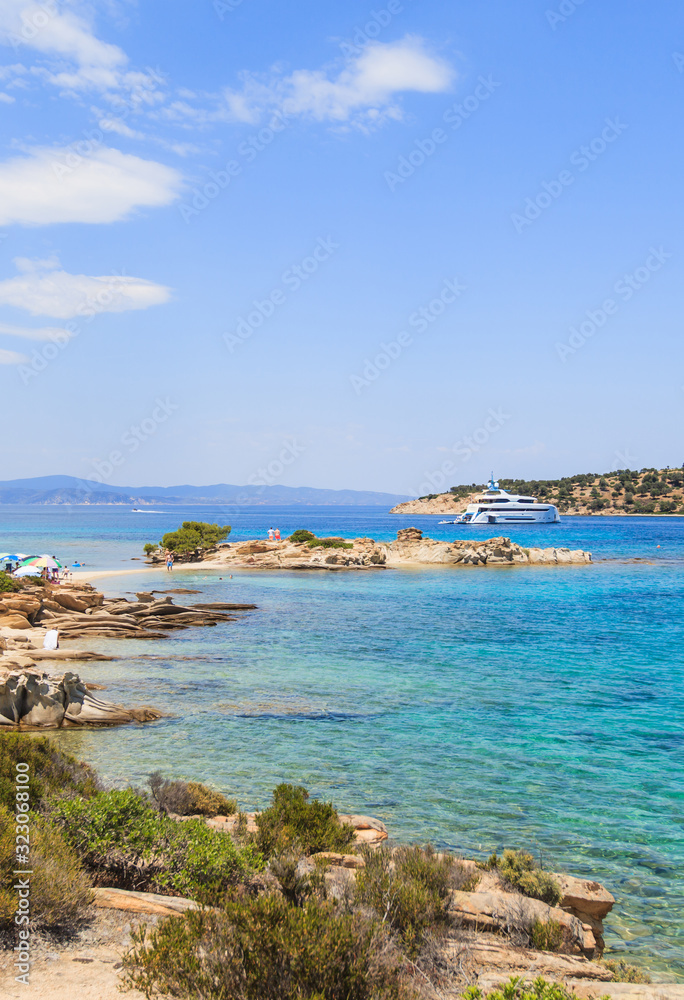 Wonderful summer seascape of turquoise sea water and yacht at co