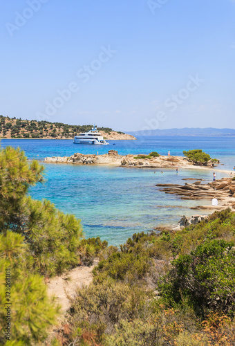 Wonderful summer seascape of turquoise sea water and yacht at co