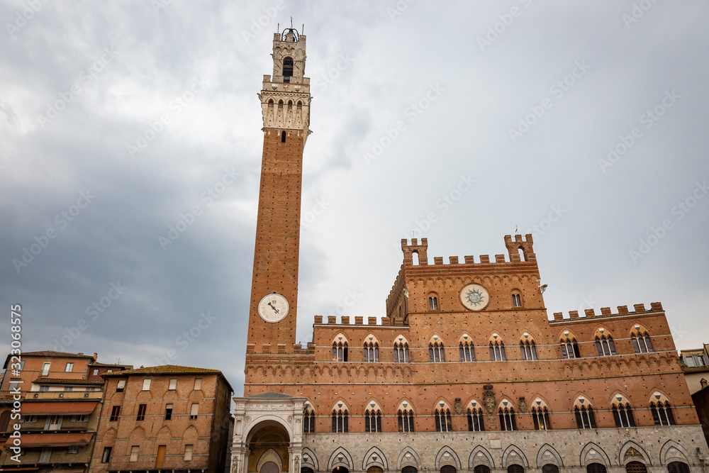 Palazzo Pubblico and Torre del Mangia tower at Piazza del Campo square in Siena city, Tuscany, Italy