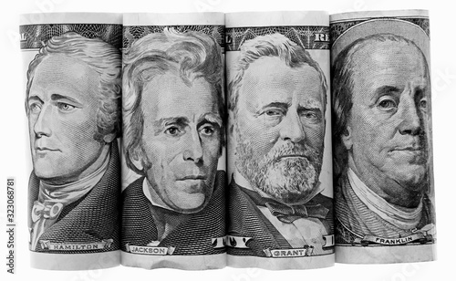 Three Presidents and Ben Franklin on US Banknotes Paper Money, side by side, federal reserve notes, rolled to show only portraits, Hamilton, Jackson, Grant photo