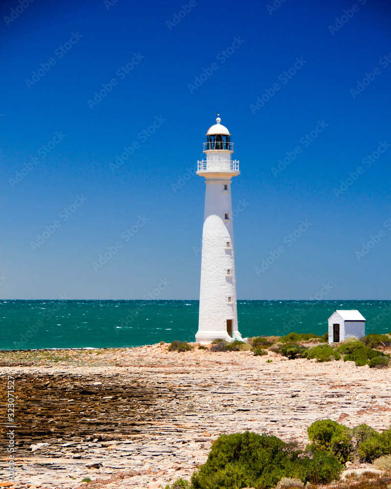 Lighthouse on the quite turquoise beach at point lowely in Australia