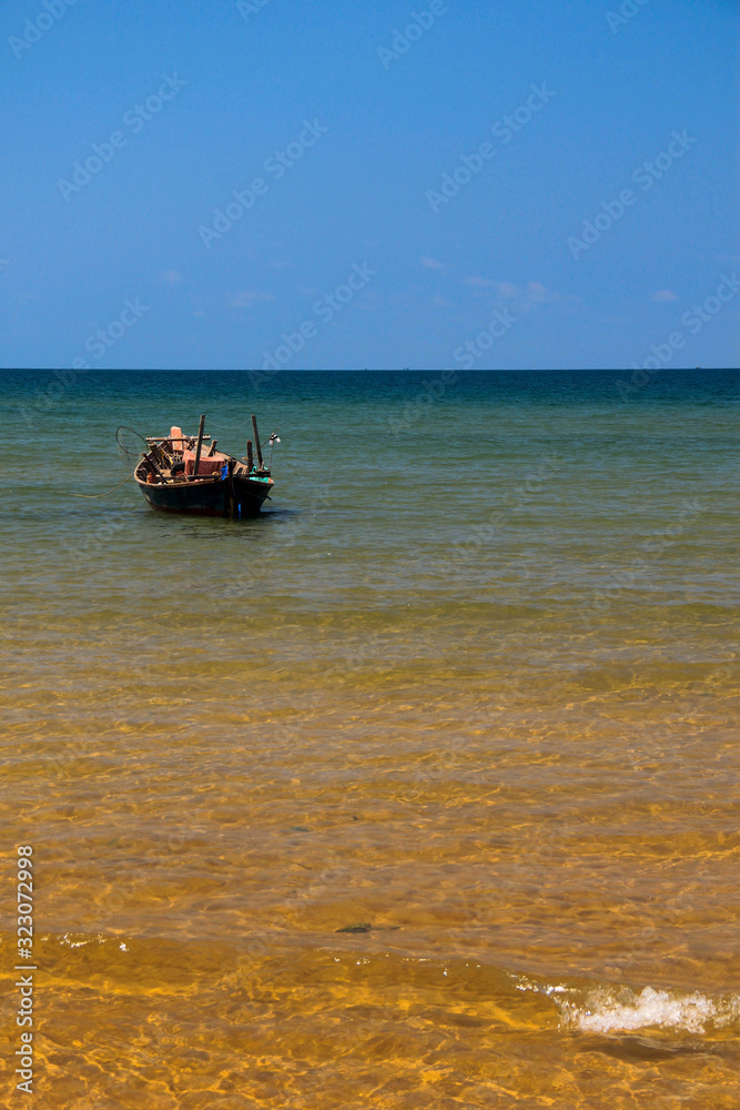 Small fishing boat near the beach in Thailand