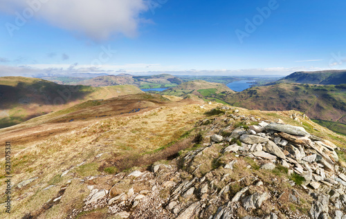 Obraz na płótnie The mountain summit of Beda Head with High Dodd and Ullswater in the distance on a sunny day in the Lake District UK w salonie