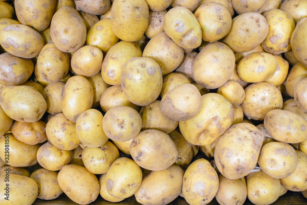 new potatoes texture. new potatoes on market table closeup photo. new potatoes texture. new potatoes on market table closeup photo.