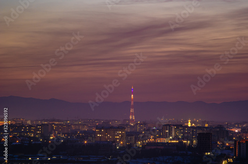 Beautiful sunset sky over the evening city