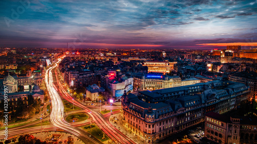 Long exposure of University Square during rush hour busy intersection in Bucharest at dusk