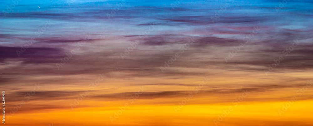 Obraz premium Panorama of beautiful colorful clouds in the sunset sky