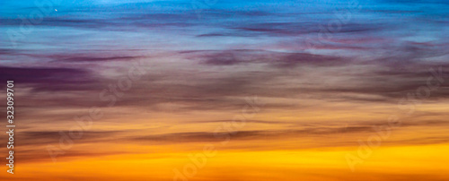 Panorama of beautiful colorful clouds in the sunset sky © onyx124