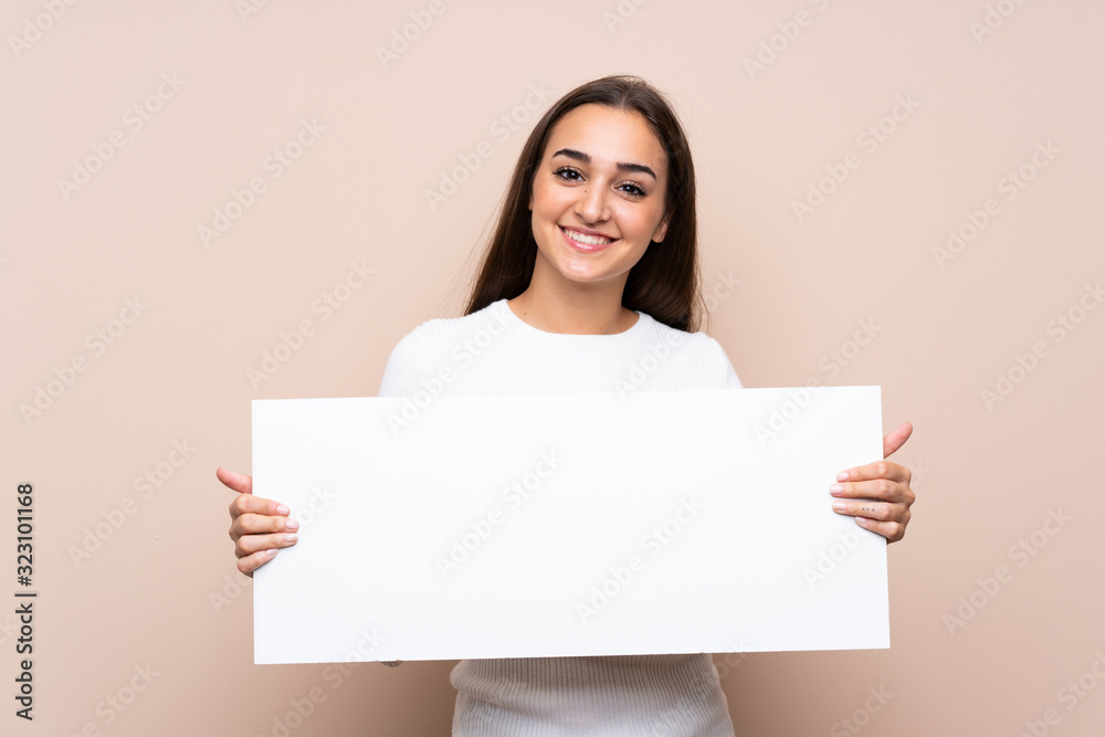 Young woman over isolated background holding an empty white placard for insert a concept Young woman over isolated background holding an empty white placard for insert a concept