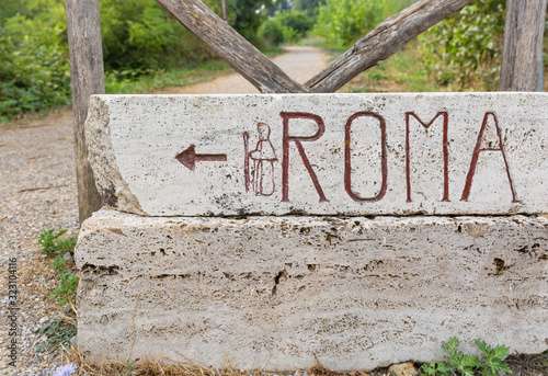 Canvas Print Via Francigena (pilgrim's route to Rome) way marker showing the direction to Rom