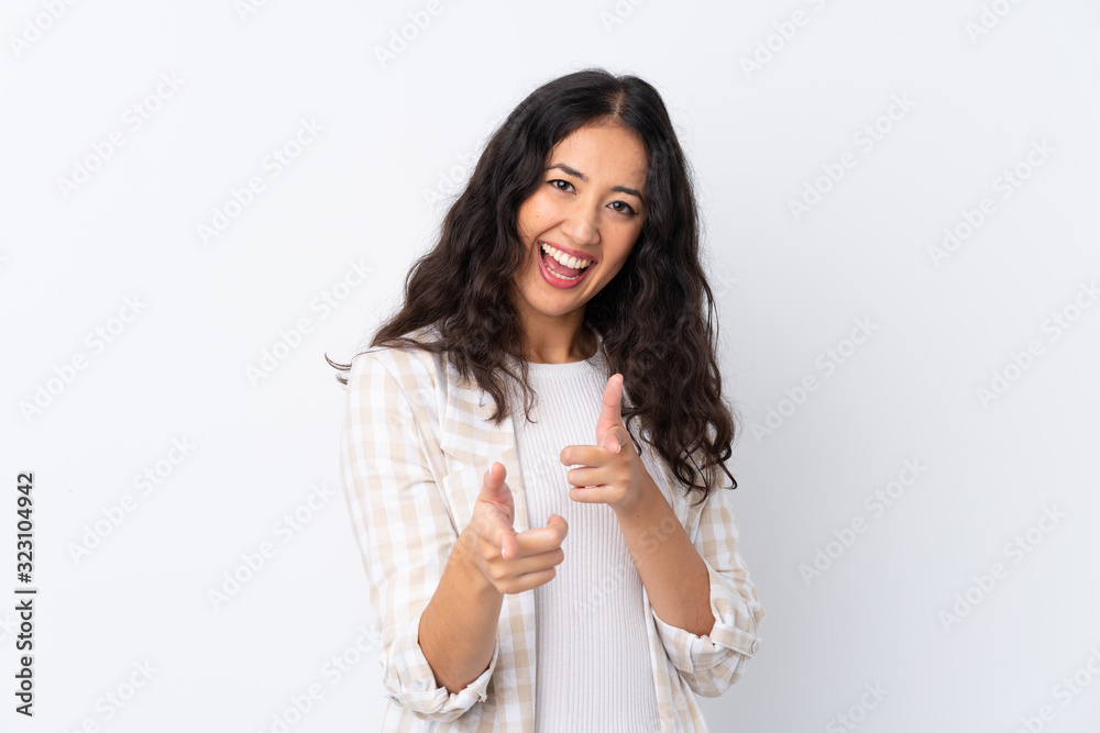Mixed race woman over isolated white background pointing to the front and smiling Mixed race woman over isolated white background pointing to the front and smiling