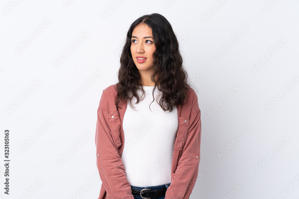 Spanish Chinese woman over isolated white background standing and looking to the side Spanish Chinese woman over isolated white background standing and looking to the side