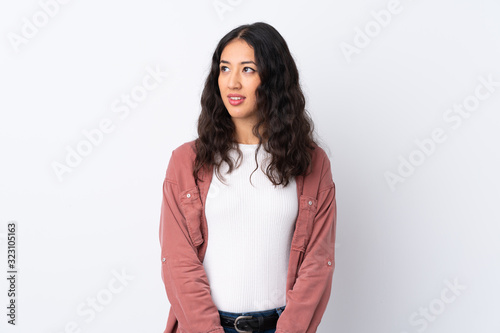 Spanish Chinese woman over isolated white background standing and looking to the side