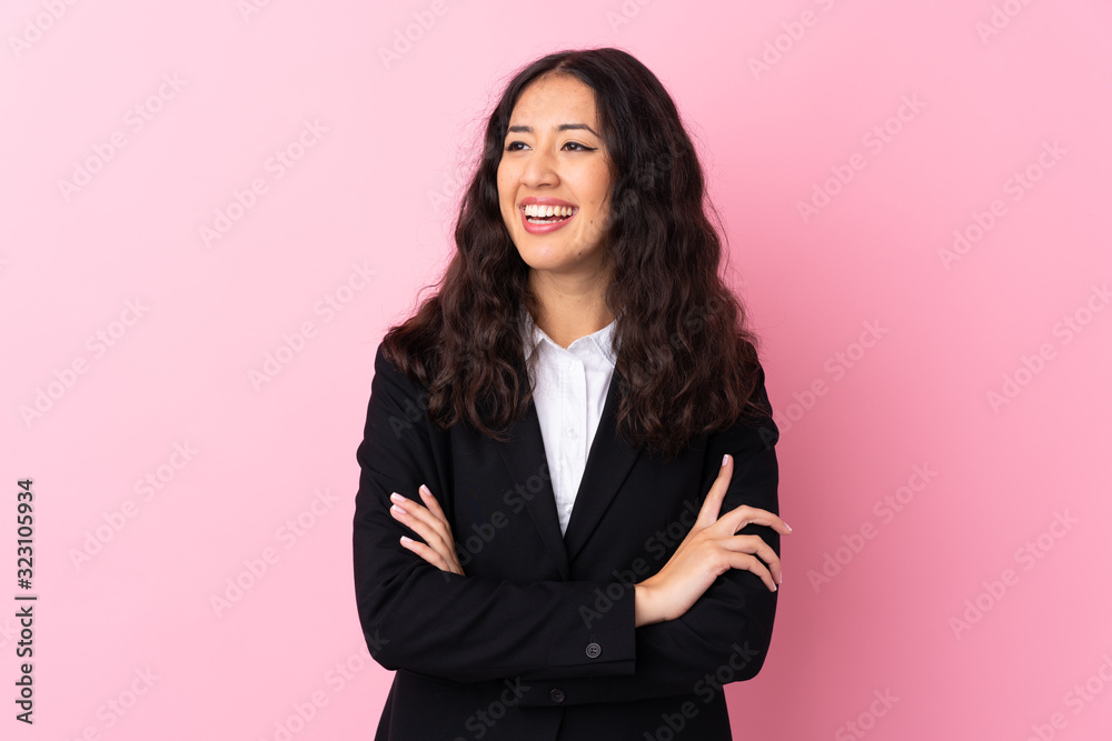 Mixed race business woman over isolated pink background laughing Mixed race business woman over isolated pink background laughing